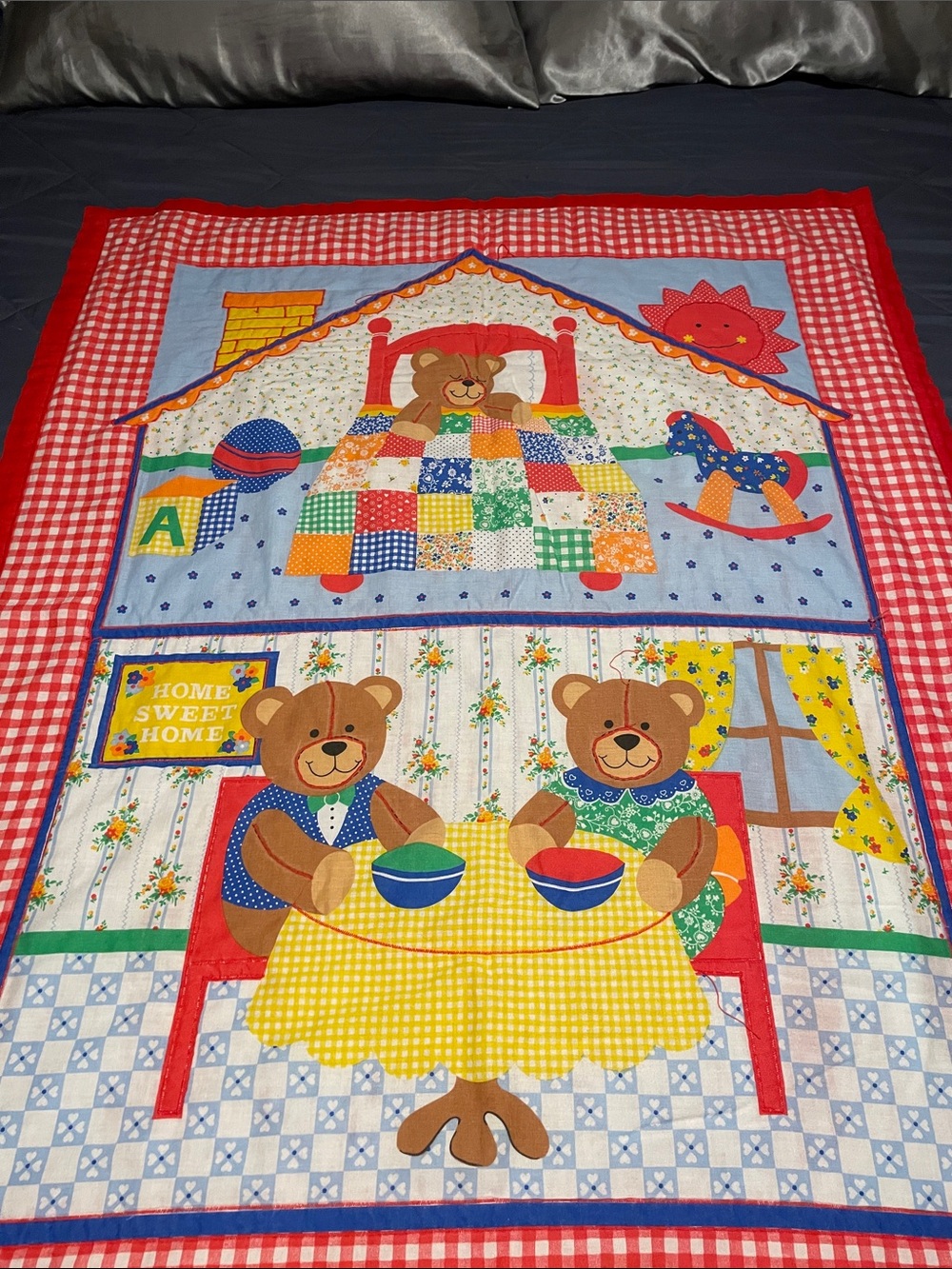 Vintage quilted baby blanket featuring a "Home Sweet Home" teddy bear motif,